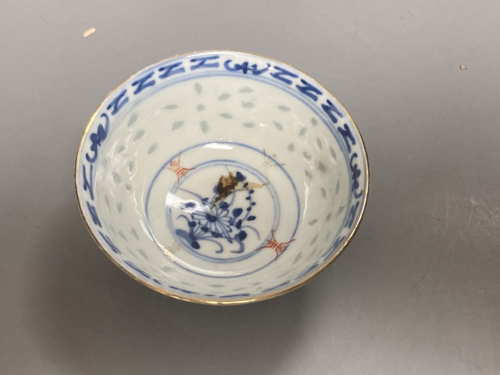 An 18th century English blue and white tea bowl and three smaller Chinese ceramic cups, two marks